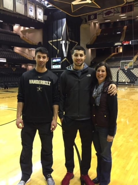 John Cressler's two sons and wife posing for a photo.